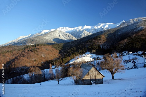 Small traditional village in the mountains during a sunny winter day