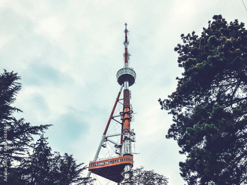 Obraz premium TV tower on the sky background in Mtatsminda Park on the funicular
