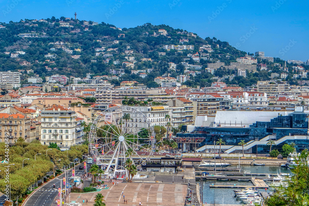 Fototapeta premium Ferris wheel on Promenade De la Pantiero in Cannes, Cote dAzur, French, Riviera, South of France, Europe
