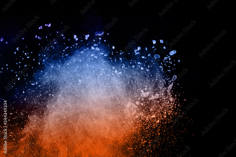 abstract colored dust explosion on a black background.abstract powder splatted background,Freeze motion of color powder exploding/throwing color powder, multicolored glitter texture. - obrazy, fototapety, plakaty 