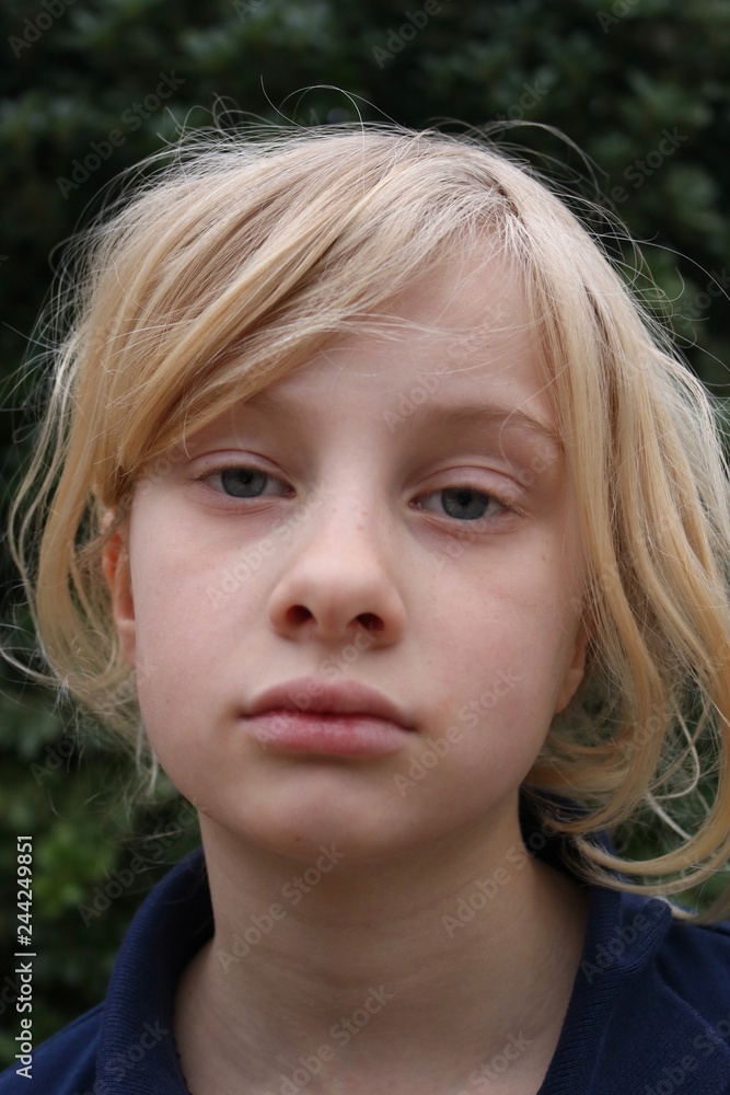 Portrait of a pale unhappy tired listless young blond girl Portrait of a pale unhappy tired listless young blond girl