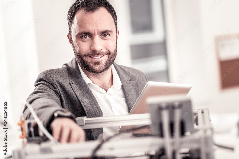 Smiling designer printing model on 3D printer Smiling designer printing model on 3D printer