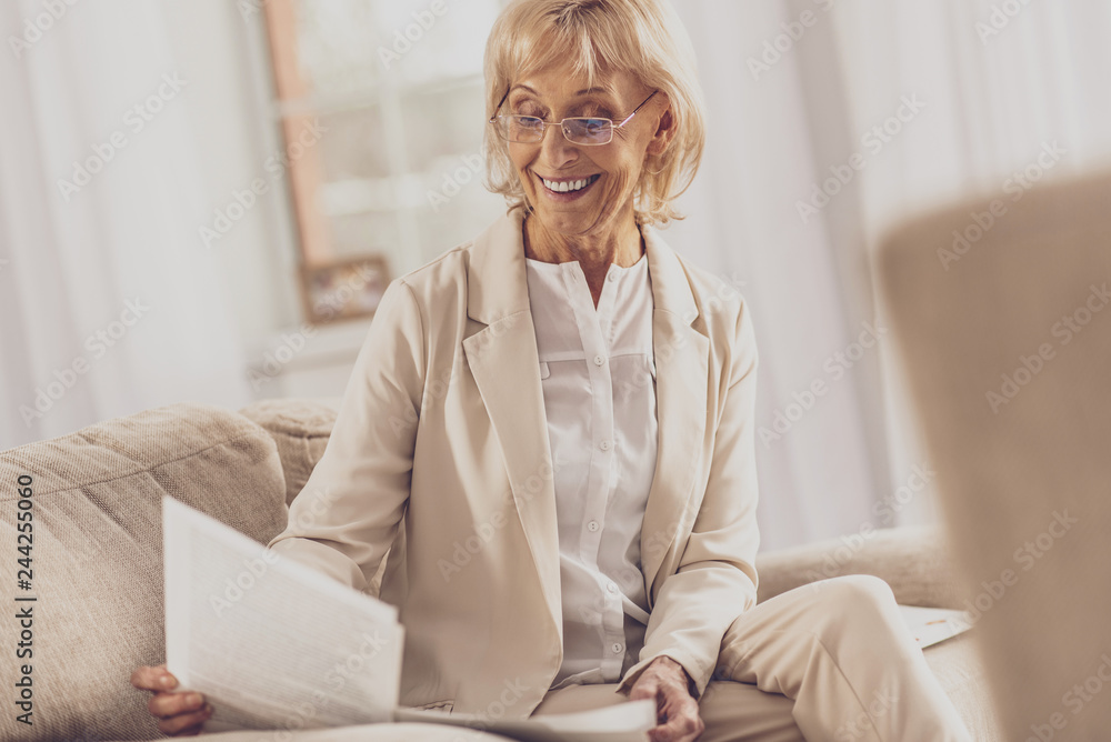 Positive delighted senior businesswoman working at home Positive delighted senior businesswoman working at home