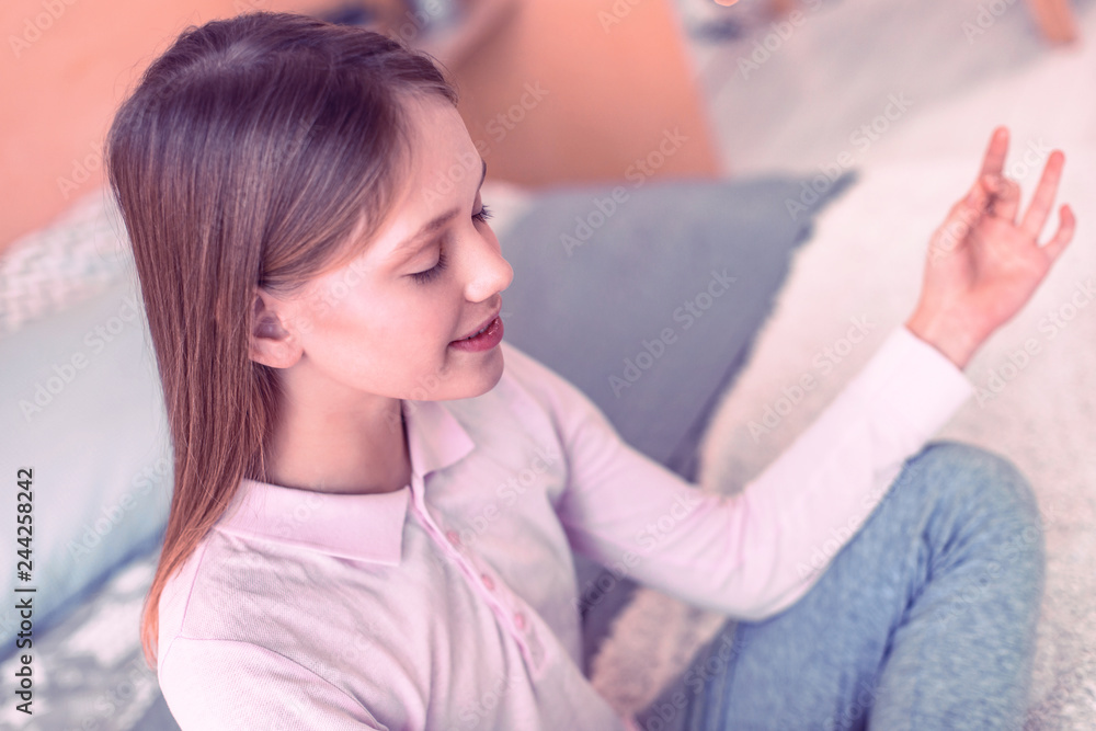 Young smiling girl sitting on the bad Young smiling girl sitting on the bad
