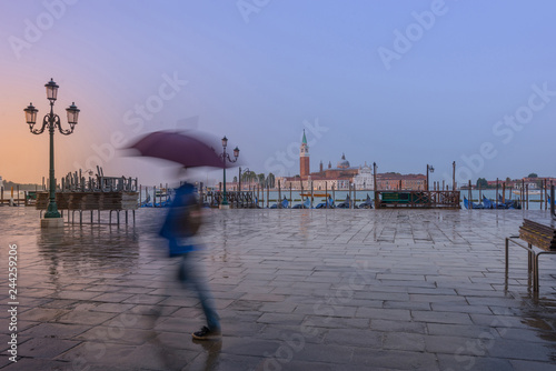 a man in a hurry with umbrella