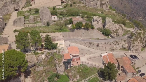 Stunning riseup 4k drone aerial footage towards the rock and cross in Bova, a small Italian village in the hills in Calabria