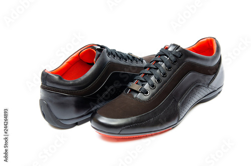 Black sporty shoes isolated on white background © Elnur