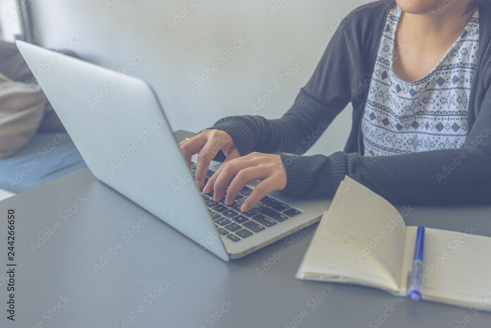 Asian business staff working on laptop to chat with customer Asian business staff working on laptop to chat with customer
