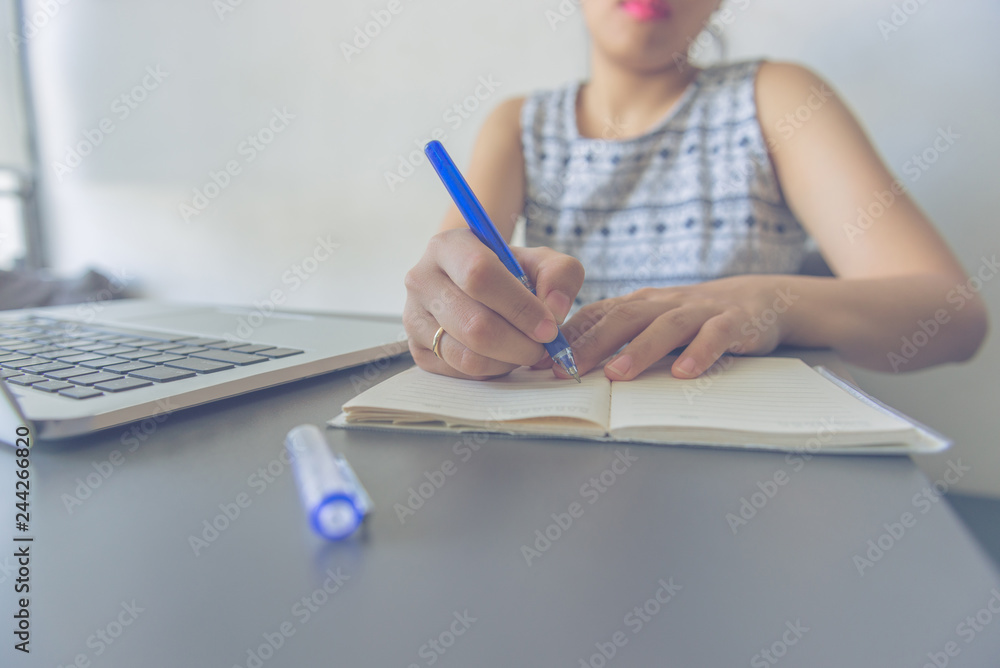 Young Asian woman writing note diary concept Young Asian woman writing note diary concept