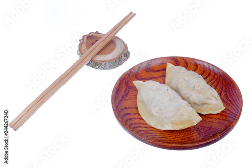 Dim Sum Chinese Dumplings and chopsticks with sauce isolated on white background, with clipping path .