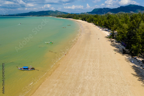Aerial drone view of a quiet, sandy tropical beach (Coconut Beach, Khao Lak, Thailand)