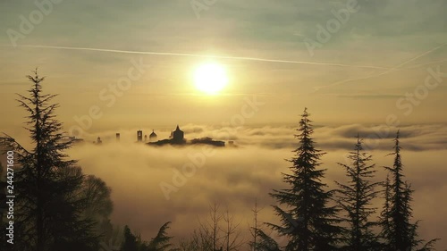 Bergamo, Italy. Timelapse amazing landscape of the fog rises from the plains and covers the old town at sunrise