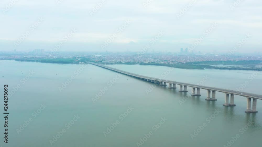 Beautiful aerial scenery of Suramadu Bridge on the Madura Strait from Surabaya City to Madura Island, East Java, Indonesia. Shot in 4k resolution Beautiful aerial scenery of Suramadu Bridge on the Madura Strait from Surabaya City to Madura Island, East Java, Indonesia. Shot in 4k resolution