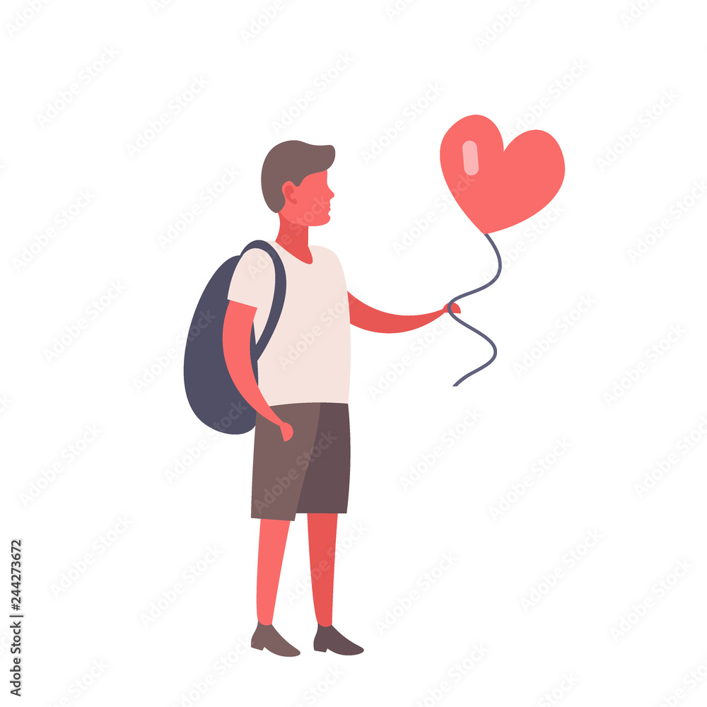 Man holding red heart shape air balloon Man holding red heart shape air balloon