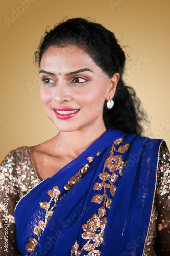 Beautiful Indian woman wearing blue saree dress