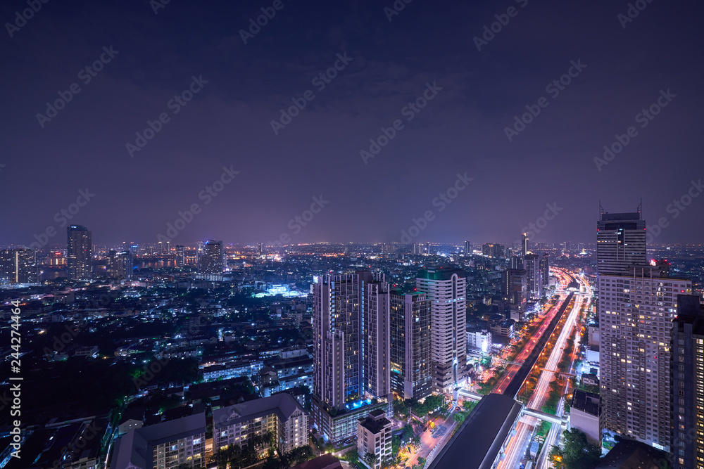 night cityscape light with sky train railway and skyline