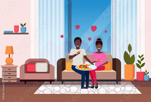 happy couple eating pizza african american man woman sitting on couch modern apartment home living room interior male female cartoon characters flat horizontal