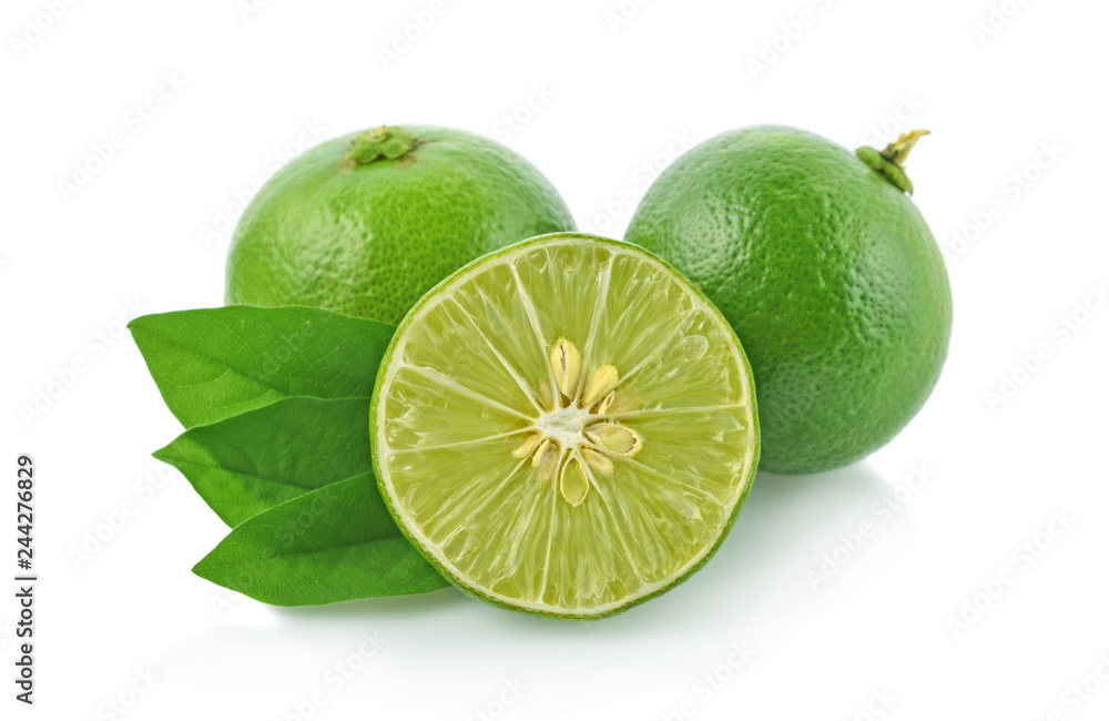 Lime with green leaves isolated on white background Lime with green leaves isolated on white background