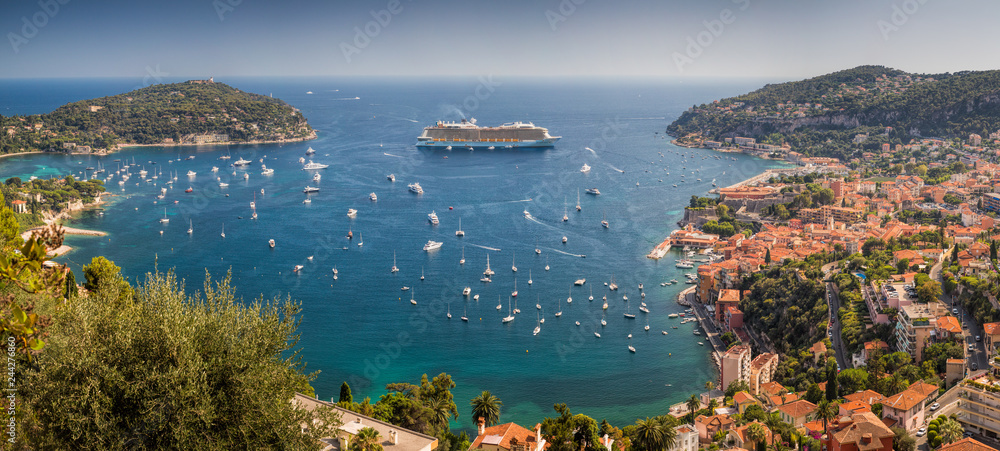 Naklejka premium View overlooking the harbour at Villefranche-sur-mer with many yachts and a luxury cruiseliner visible