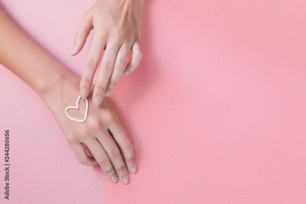 hand cream. like a heart. the concept of skin care, hydration and nutrition. manicure, soft hands, velvety soft skin. youth hand cream. like a heart. the concept of skin care, hydration and nutrition. manicure, soft hands, velvety soft skin. youth