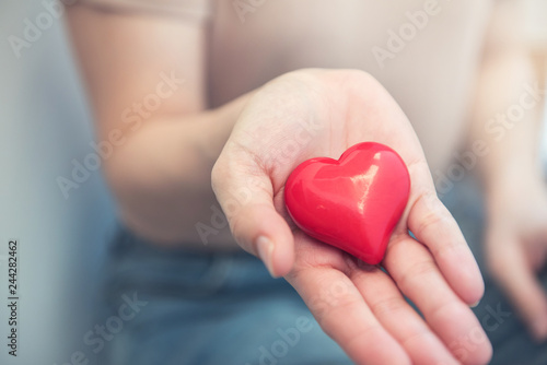 Female hands holding red heart  Love concept for valentines day with sweet and romantic moment.
