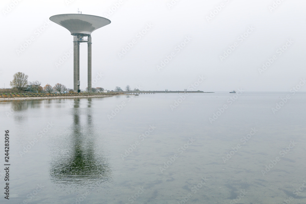 Beautiful water tower with sea on foreground in Landskrona, Sweden. Gray rainy day