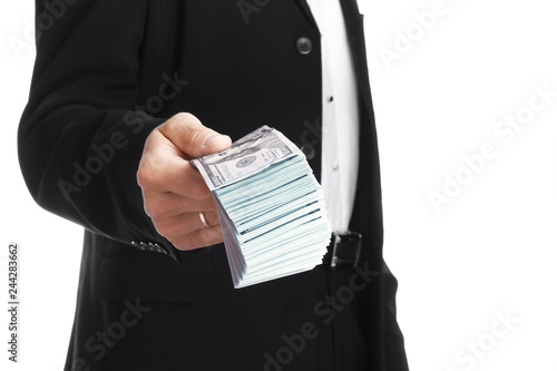 Business man holding money on white background