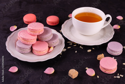 Wedding, St. Valentine's Day, birthday, preparation, holiday. Beautiful pink tasty macaroons on a concrete background