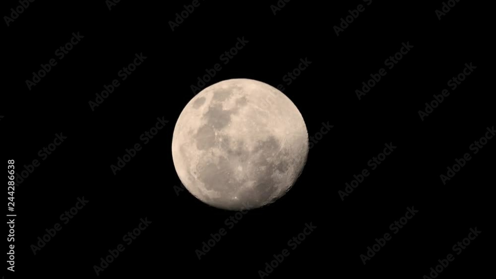 Full moon at night with clouds floating through Full moon at night with clouds floating through