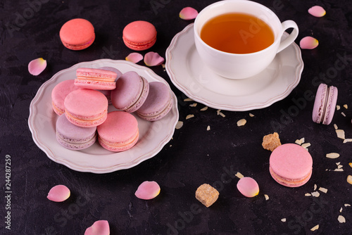 Wedding, St. Valentine's Day, birthday, preparation, holiday. Beautiful pink tasty macaroons on a concrete background