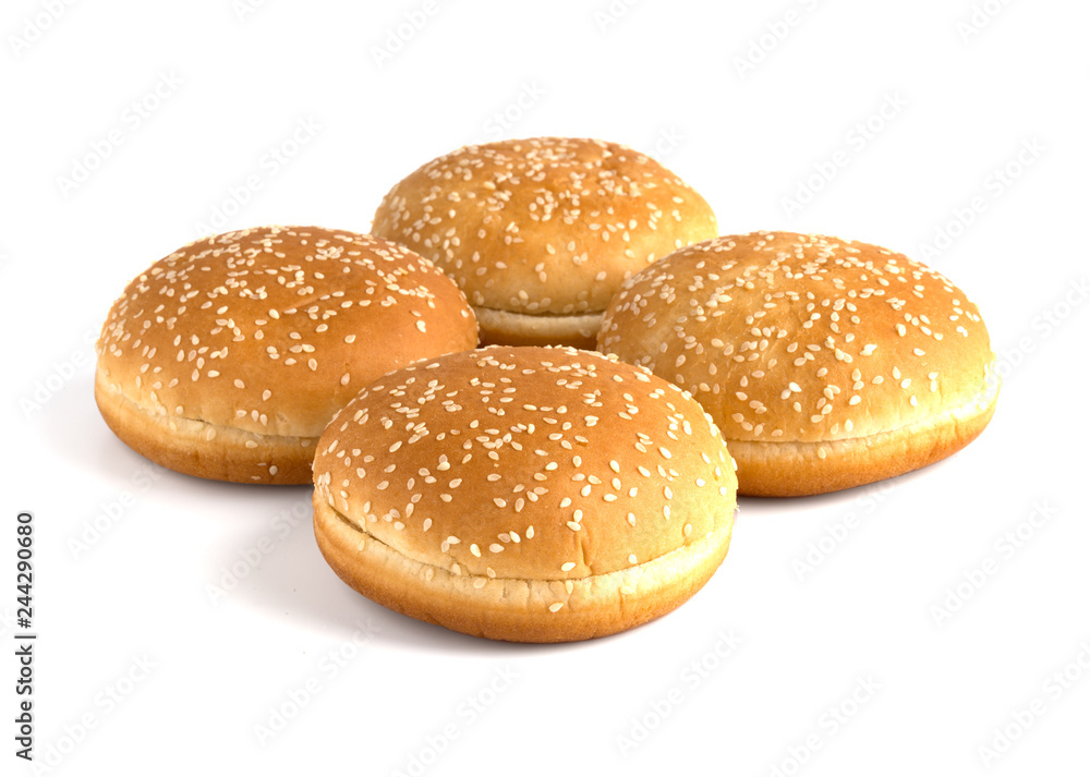 Burger buns on white background. A few buns cut in half close up on a white background.