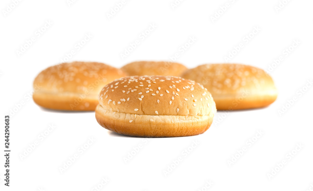 Burger buns on white background. A few buns cut in half close up on a white background.