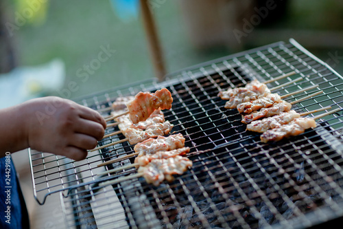 Barbecue pork Toast grill or Toast pork with Thai garnish nutrition preparation for cooking. Thai food  Street food.Pork satay grilling on stove or Thai style roasted pork at the market.