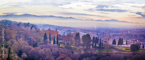 Granada city panorama view. Panoramic view from a tower of Alhambra to the city center of Granada ,Andalucia, Spain with Sierra Nevada in the background photo