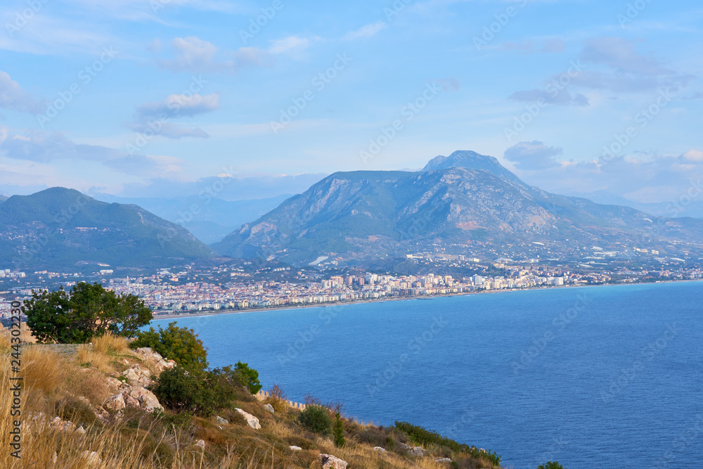 Sea coast of Alanya/ Antalya, Turkey with mountains and clouds on sky. Sea coast of Alanya/ Antalya, Turkey with mountains and clouds on sky.