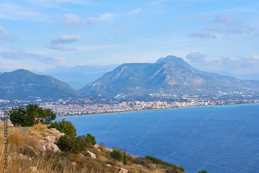 Sea coast of Alanya/ Antalya, Turkey with mountains and clouds on sky.