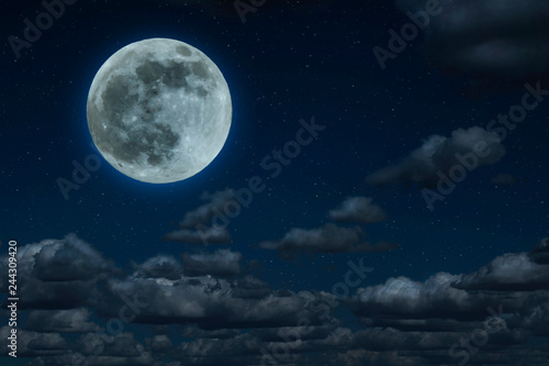 Moon and clouds in the night. Moonlight background.