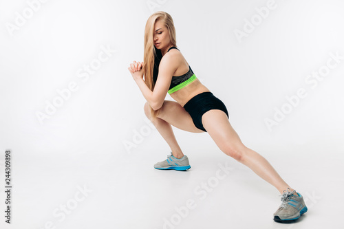 intensive training for legs muscles. flexibility. full length photo. copy space.blonde doing morning exercises.