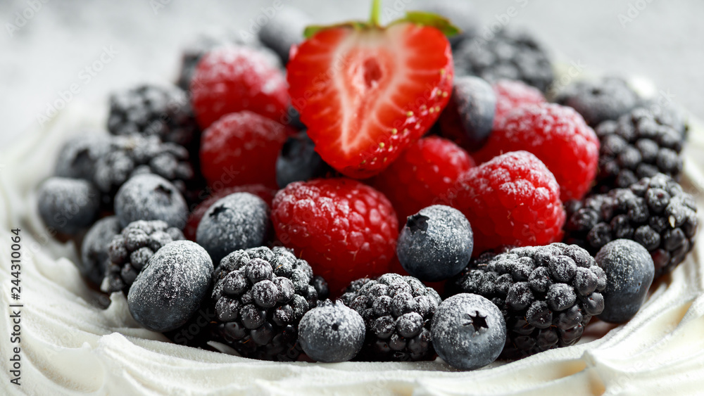 Berry Pavlova cake with fresh blueberries, strawberries and raspberries Berry Pavlova cake with fresh blueberries, strawberries and raspberries