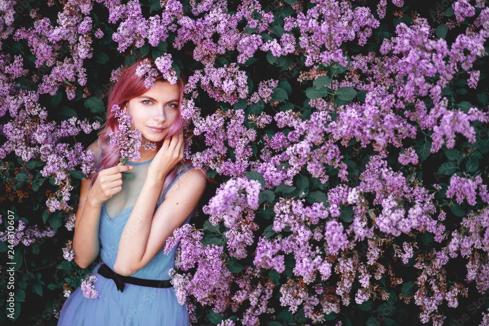 Fine art portrait of girl in dress in lilac garden Fine art portrait of girl in dress in lilac garden