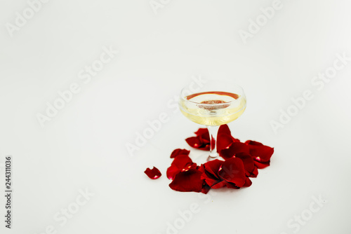 Woman's day holiday 8 march wallpaper. Background, copyspace. Horizontal top view. Red rose and shampagne glass. photo