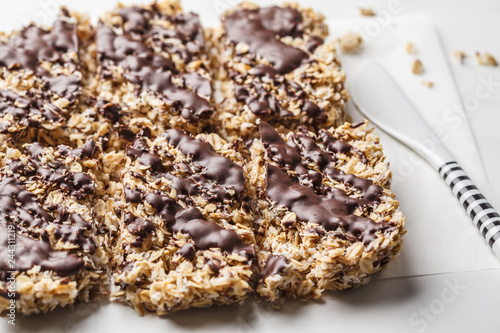 Homemade chocolate oat bars on a white background. Healthy vegan dessert  detox food