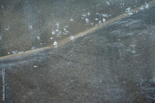 Rain bubbles on asphalt photo