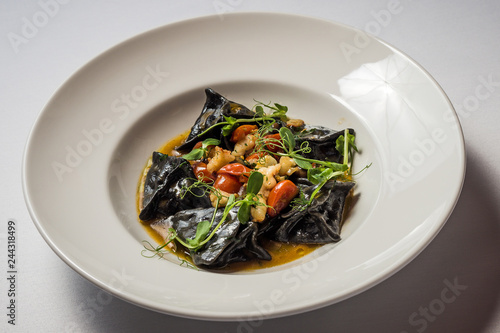 Black ravioli with cod and shrimp