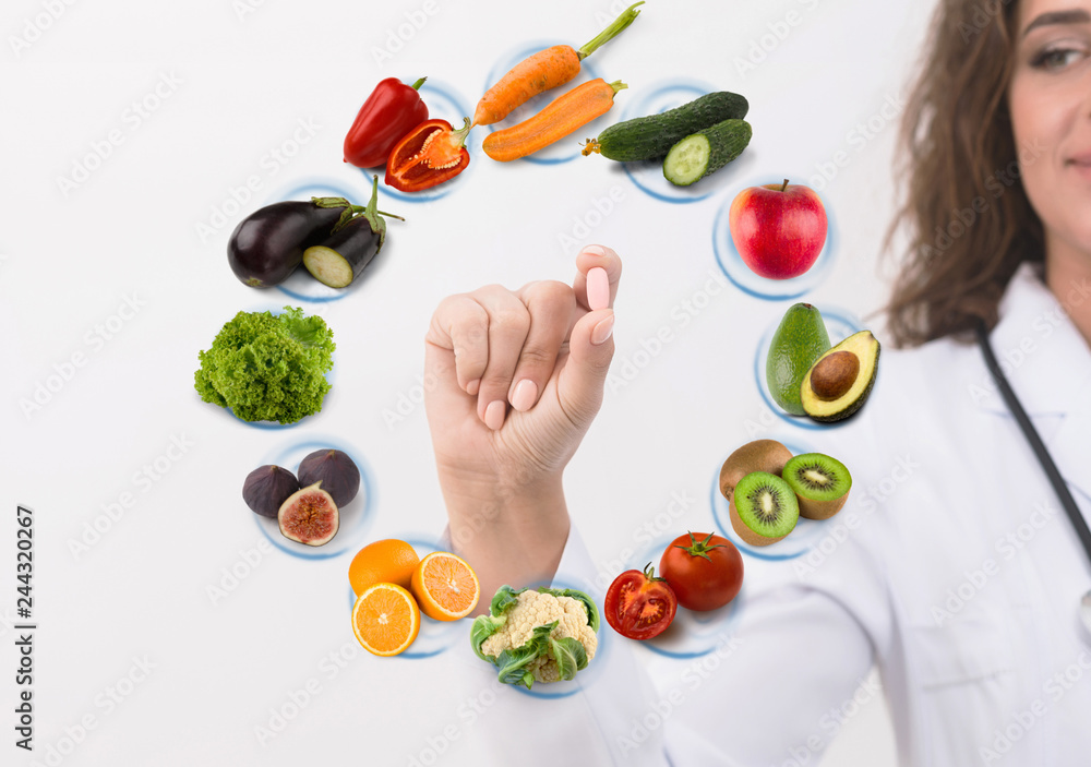 Φωτογραφία Hand of nutritionist doctor showing pill on symbols fruits
