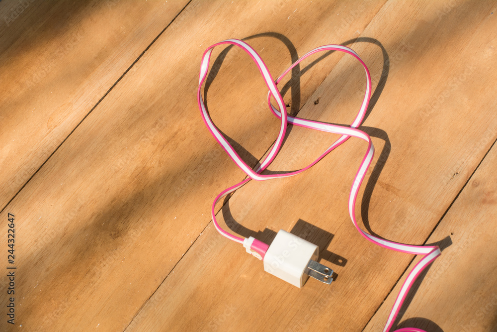 Cable connector USB-B or USB-C on wooden background, Connector with wire, Concept of connection, Design is heart shapes for valentine days, Love concepts Cable connector USB-B or USB-C on wooden background, Connector with wire, Concept of connection, Design is heart shapes for valentine days, Love concepts