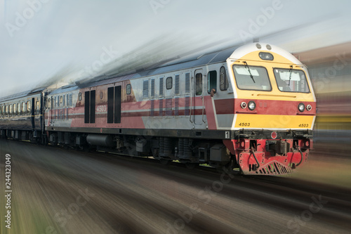 Old train in motion at the railway , Fast train passenger locomotive in motion at the railway station city