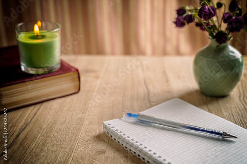 notebook and pen on wooden table