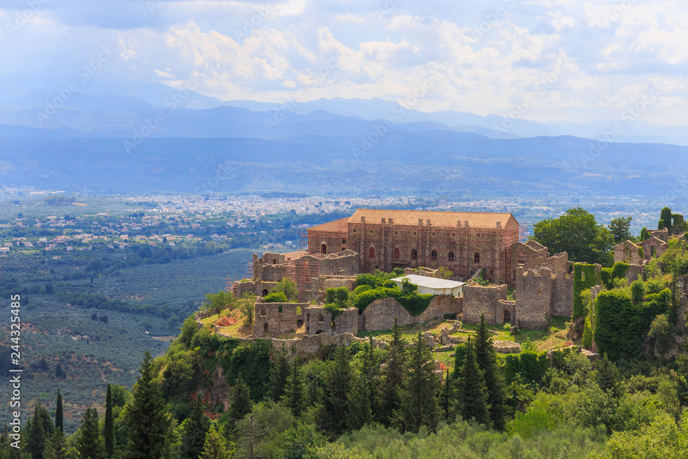 distant view on Paleolog castle in Mystras against Laconia valley, Greece, Europe