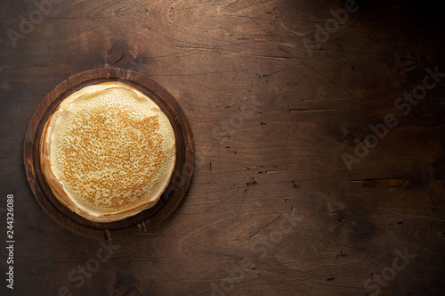 Obraz na płótnie Stack of russian pancake blini on a wooden background w salonie